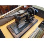 A Frister Rossmann hand crank sewing machine