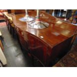 A Mahogany serpentine sideboard