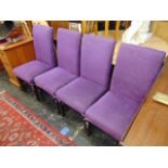Four purple upholstered dining chairs