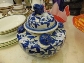A blue and white oriental lidded jar/ urn