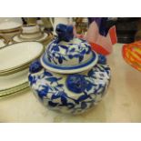 A blue and white oriental lidded jar/ urn