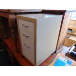 A three drawer office pedestal