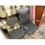 Two black office swivel chairs