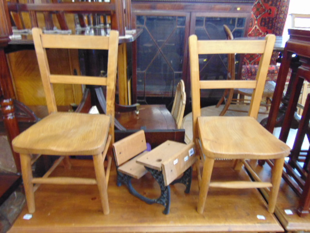 A miniature school desk and a pair of pine chairs