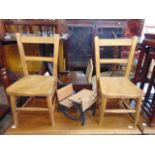 A miniature school desk and a pair of pine chairs