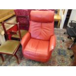 A red leather mid-century reclining chair