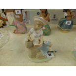 A boxed Lladro figure of a girl,