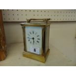 An English brass case carriage clock with key,