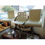 Three white and chrome bar stools