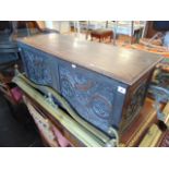 A late 19th century coffer, heavily carved,