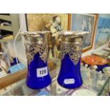 A pair of Bristol blue and metal vases