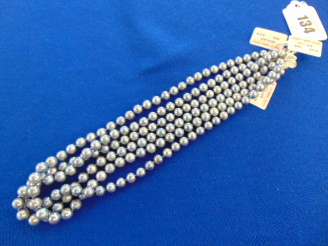 Three Grey pearl necklaces,