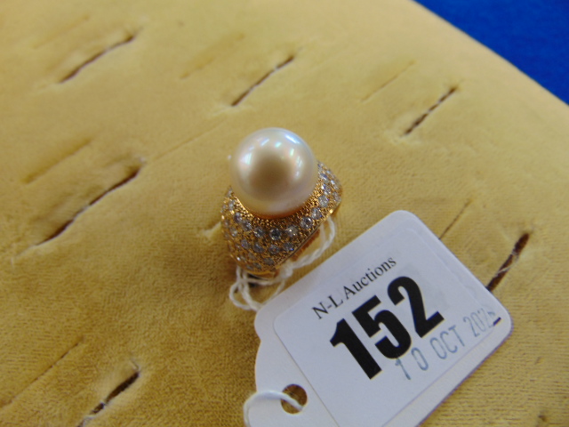 An 18ct Gold Pearl and Diamond cocktail ring, 0.60pts Diamond, 1.