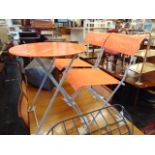 Two folding patio chairs and a table