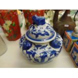 A blue and white oriental lidded jar/ urn