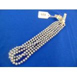 Three Grey pearl necklaces,