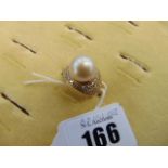 An 18ct Gold Pearl and Diamond cocktail ring, 0.60pts Diamond, 1.