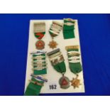 A collection of driving medals,