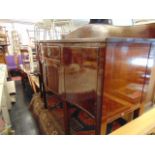 A Mahogany serpentine sideboard