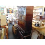 A Mahogany bookcase on cupboard base