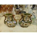 A pair of twin handled vases,