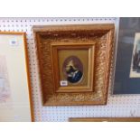 A framed portrait in ornamental frame