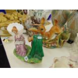 A mid century pottery figure Deer and a figure lady and gentleman,