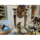 A pair of Sterling Silver candlesticks