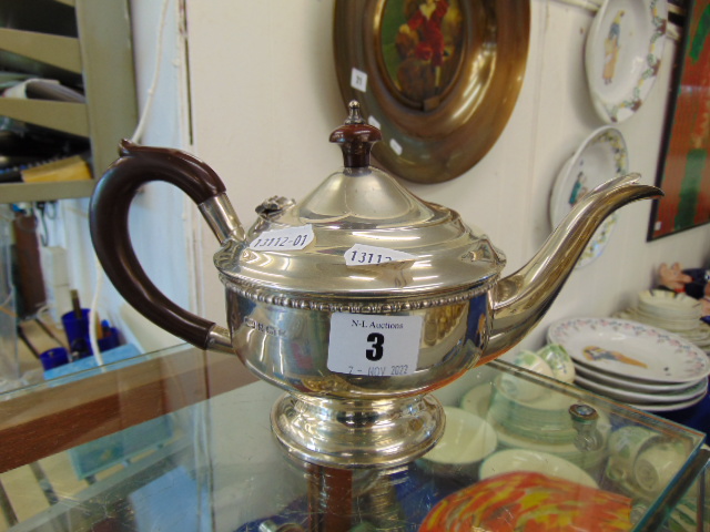 A hallmarked Silver teapot,