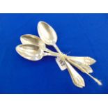 Four Danish hallmarked Silver hammered serving spoons,