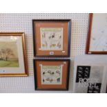 A pair of framed cartoon prints