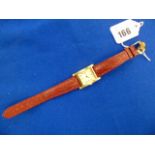 A Kiki McDonough 18ct Gold watch with leather strap