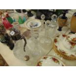 A qty of five decanters and plated claret jug