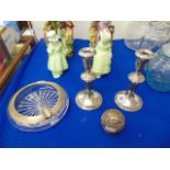 A pair of Sterling silver candlesticks one a.