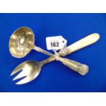 A Danish hallmarked Silver sauce ladle and a mother of pearl handled and HM silver spoon