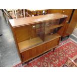 A retro Teak cabinet with sliding doors