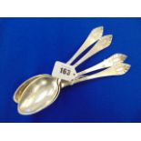Four Danish hallmarked Silver hammered serving spoons,