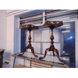 A pair of mahogany tripod tables gallery top