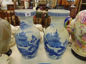 A pair of blue and white oriental vases