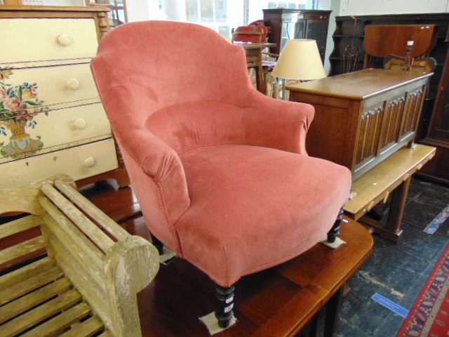 A Pink upholstered nursing chair,