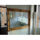 A gilt framed mirror