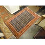 A Red/ Blue ground hand made Persian rug