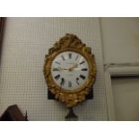 A gilt wall clock, Guibourdenche, a.