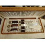 A boxed bone handled carving set with Silver mounts