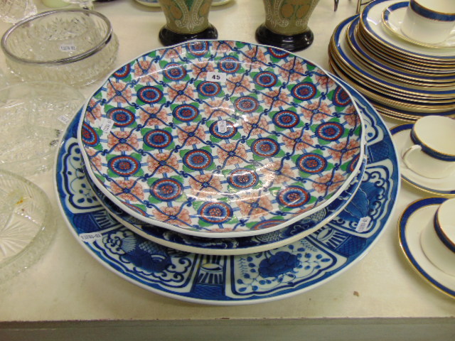 A large Delft plate and assorted Japanese plates
