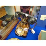 A Copper and Bakelite telephone