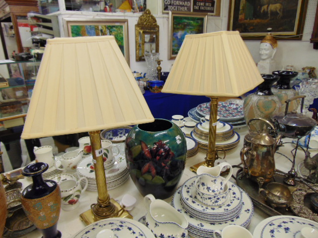 A pair of brass table lamps