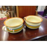 A pair of Clarice Cliff chamber pots