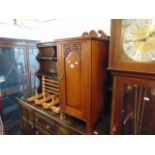 A carved bedside cabinet