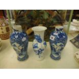 Three blue and white oriental vases,